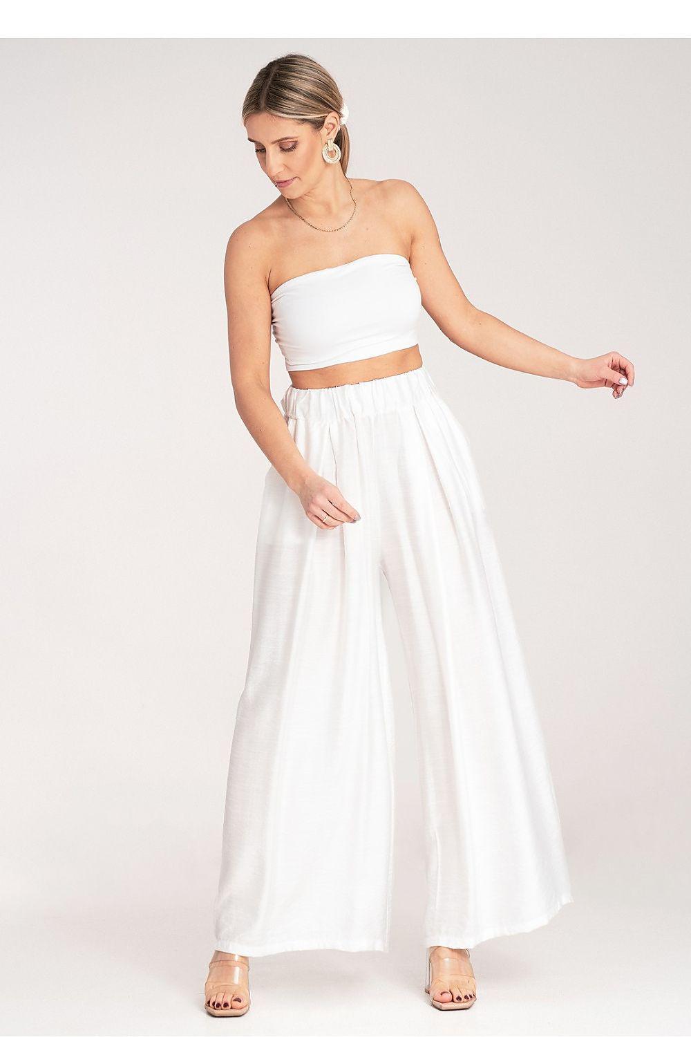 White high-waist wide-leg trousers with elastic waistband and flowing fabric
