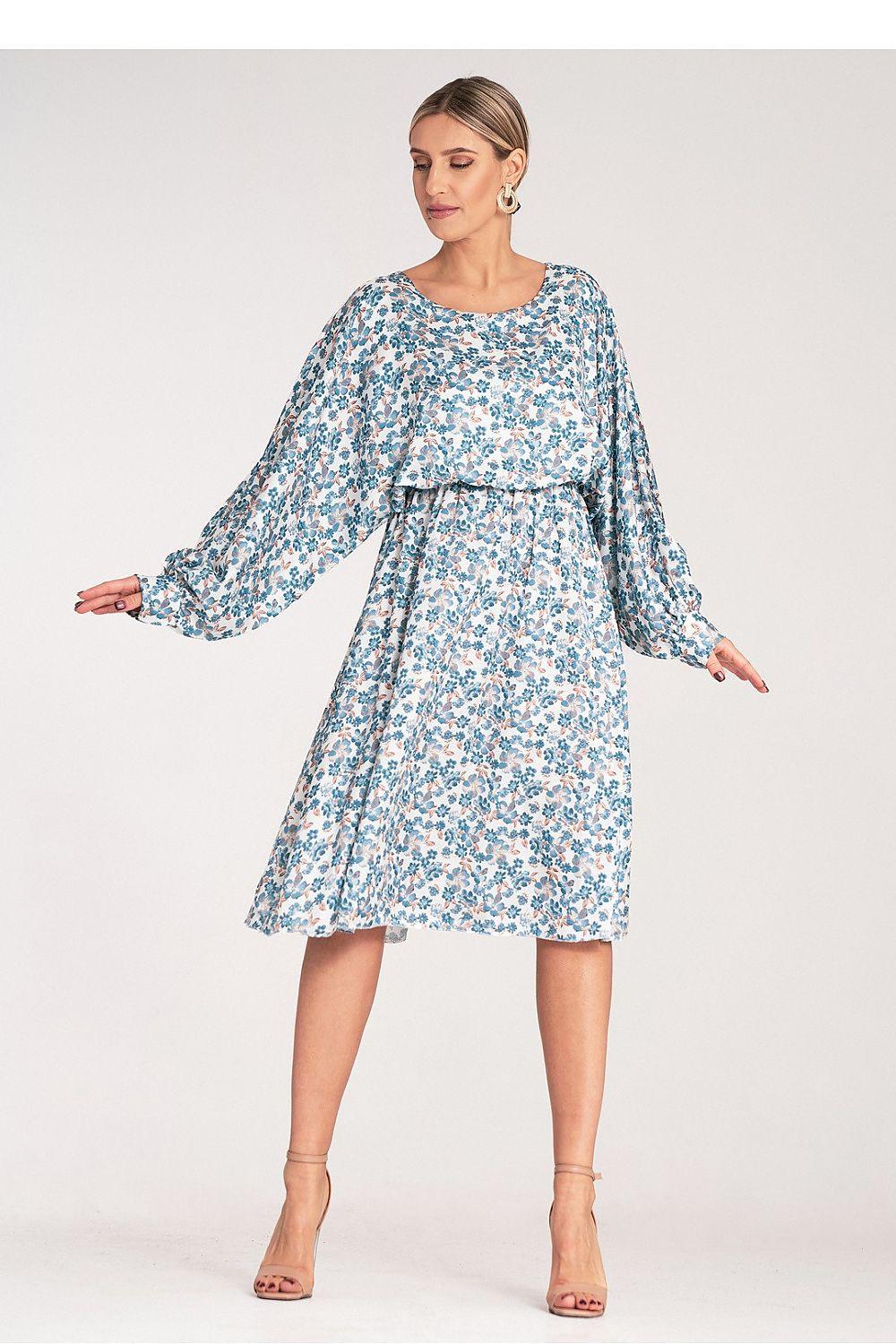 Light blue floral daydress with long sleeves, round neckline, and tiered A-line skirt