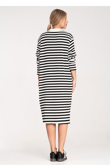 Striped knitted daydress, long sleeves, collared neckline, black-and-white stripes (back)
