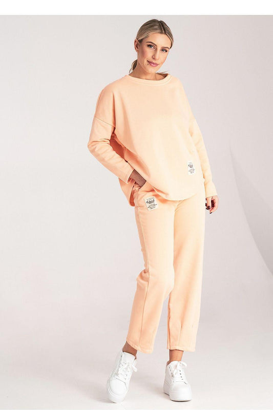 Two-piece loungewear set in light orange: long-sleeve sweatshirt and relaxed pants