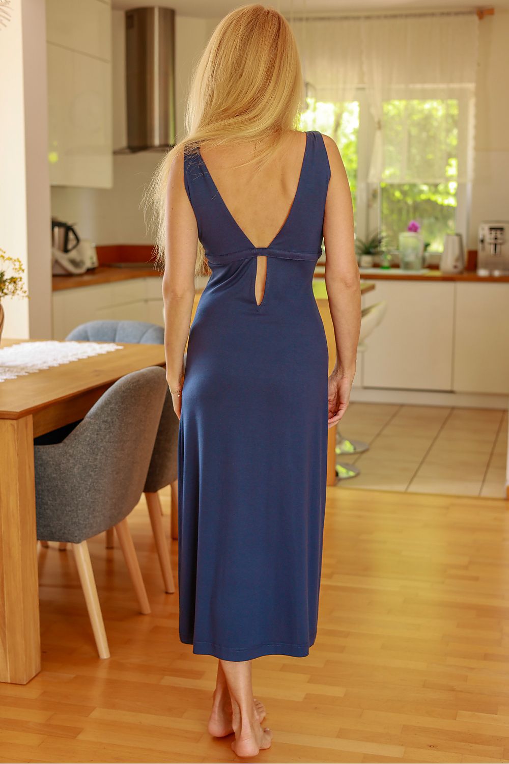 Navy sleeveless daydress back view with open-back keyhole and center seam slit