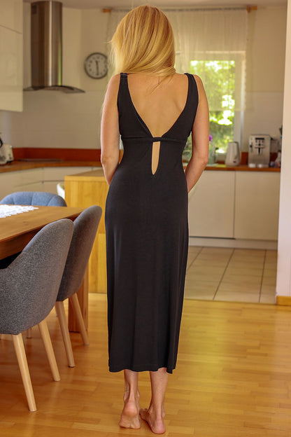 Black sleeveless daydress back view with open keyhole and center seam