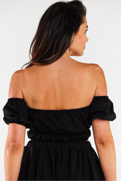 Black off-shoulder mini blouse, back view with elastic waist and puff sleeves