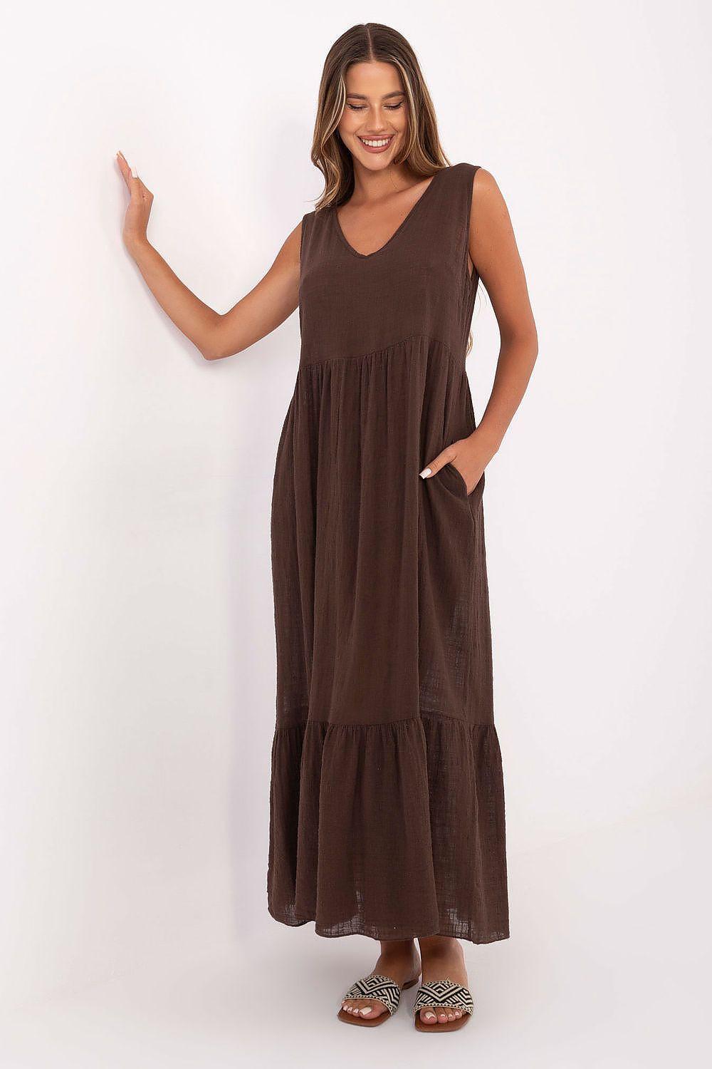 Brown cotton flared maxi daydress with V-neck and tiered skirt, sleeveless design.