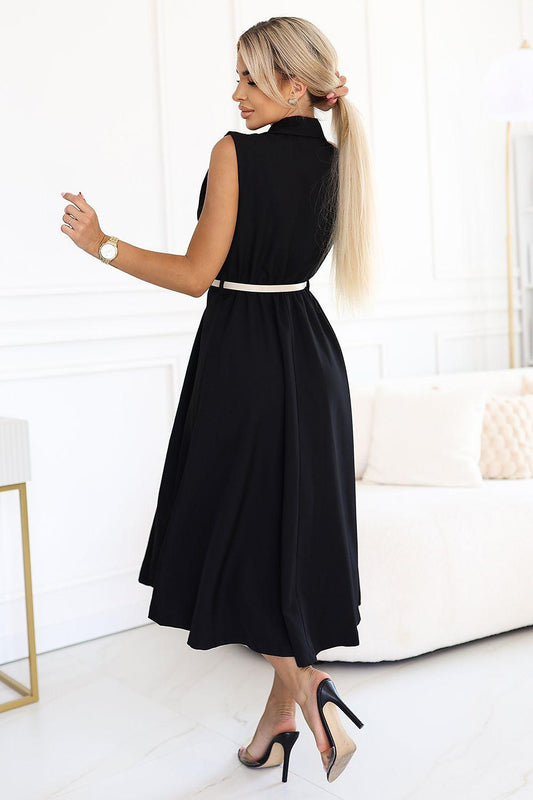 Black sleeveless daydress, gathered skirt, white tie waist belt, side view