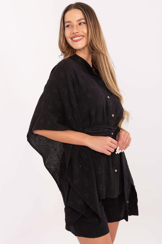 Black button-up top with tie belt, layered sleeves, and matching shorts set