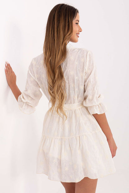 White cotton embroidered flare mini dress with gathered waist and tiered ruffle skirt