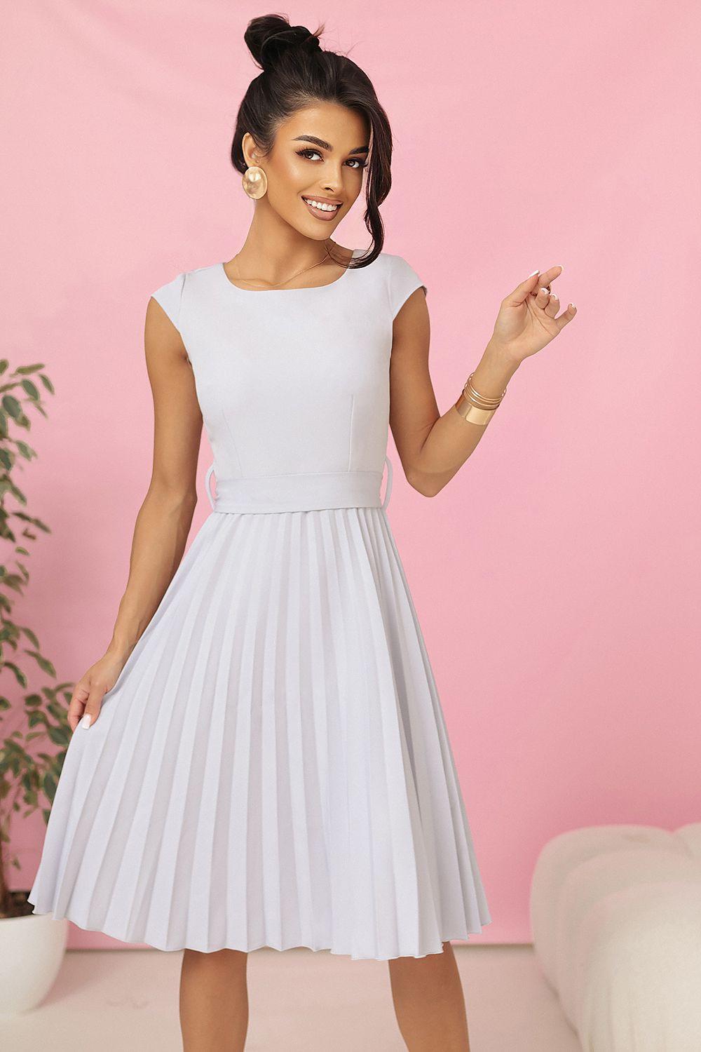 White pleated daydress with fitted waist and cap sleeves