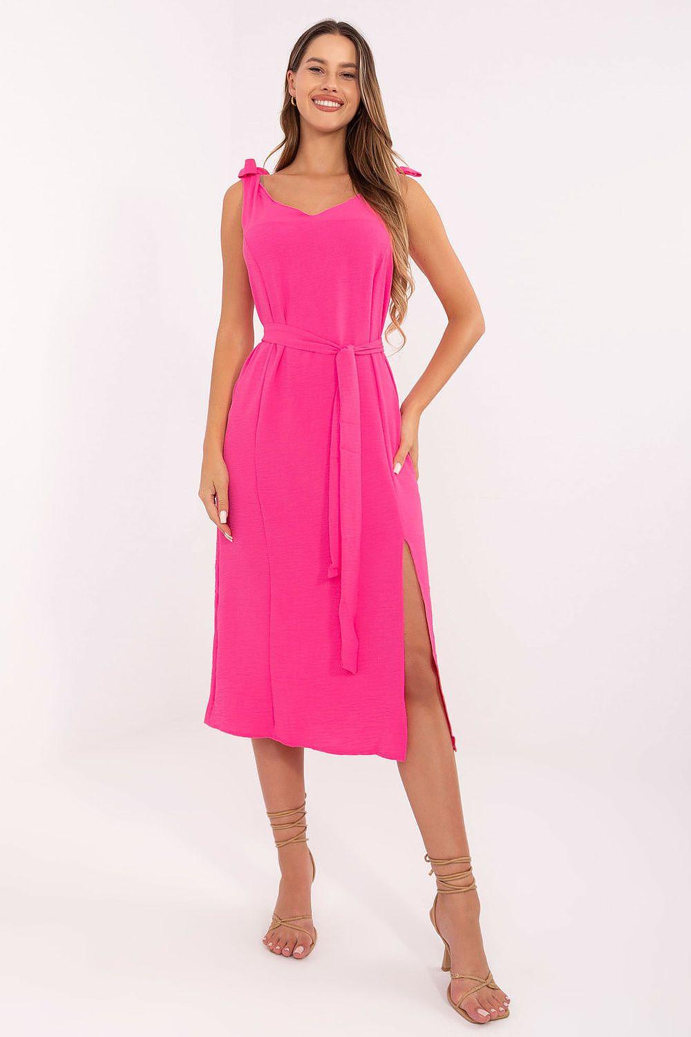 Pink sleeveless daydress with V neckline, tie waist, and side slit
