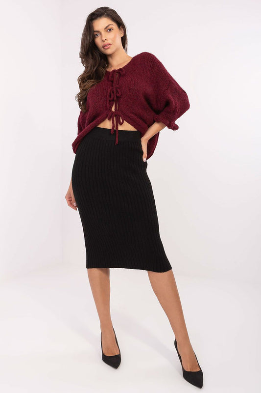 Black ribbed knit midi skirt, fitted silhouette with elastic waistband