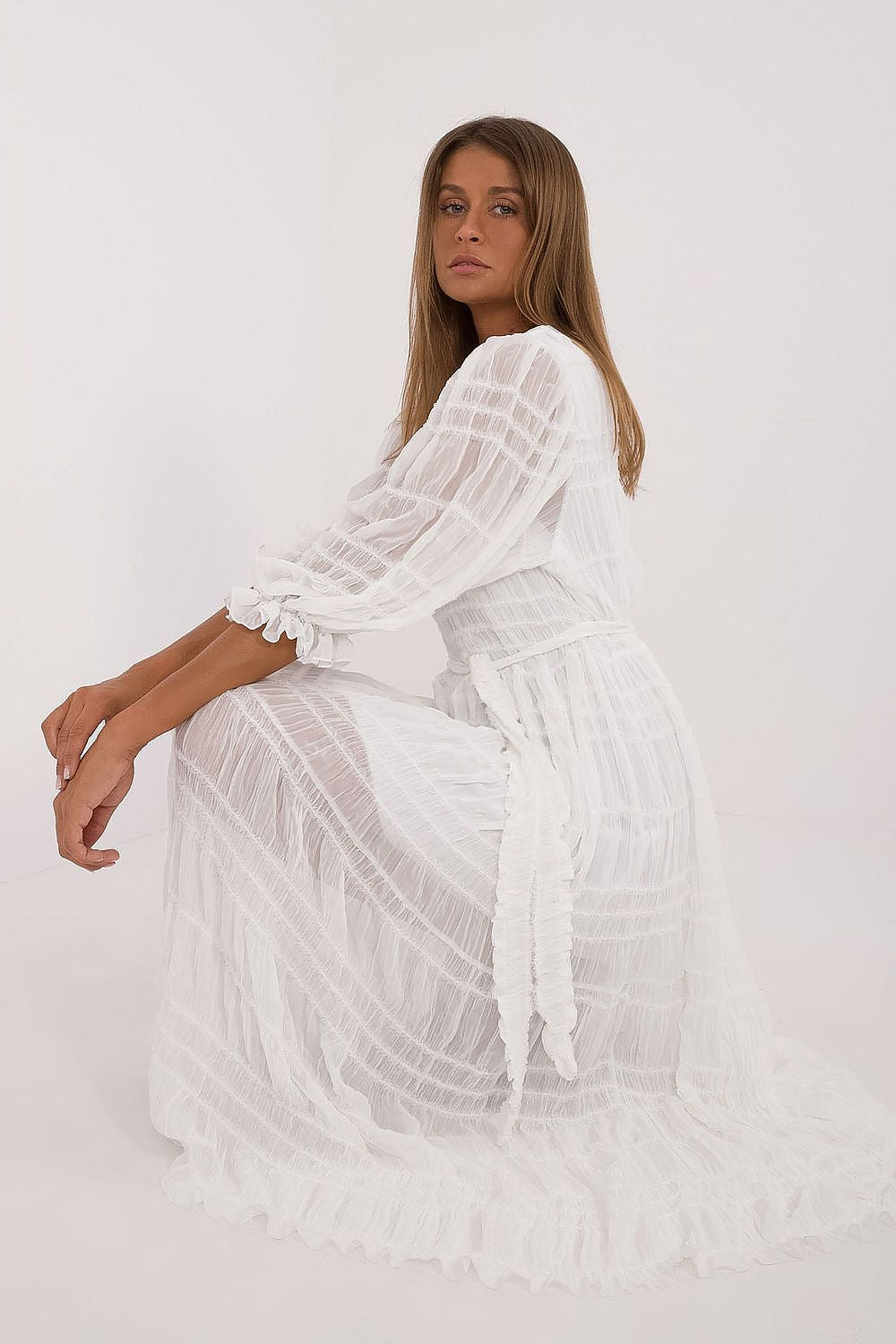 White midi daydress with tiered layers, flared skirt, and billowy long sleeves
