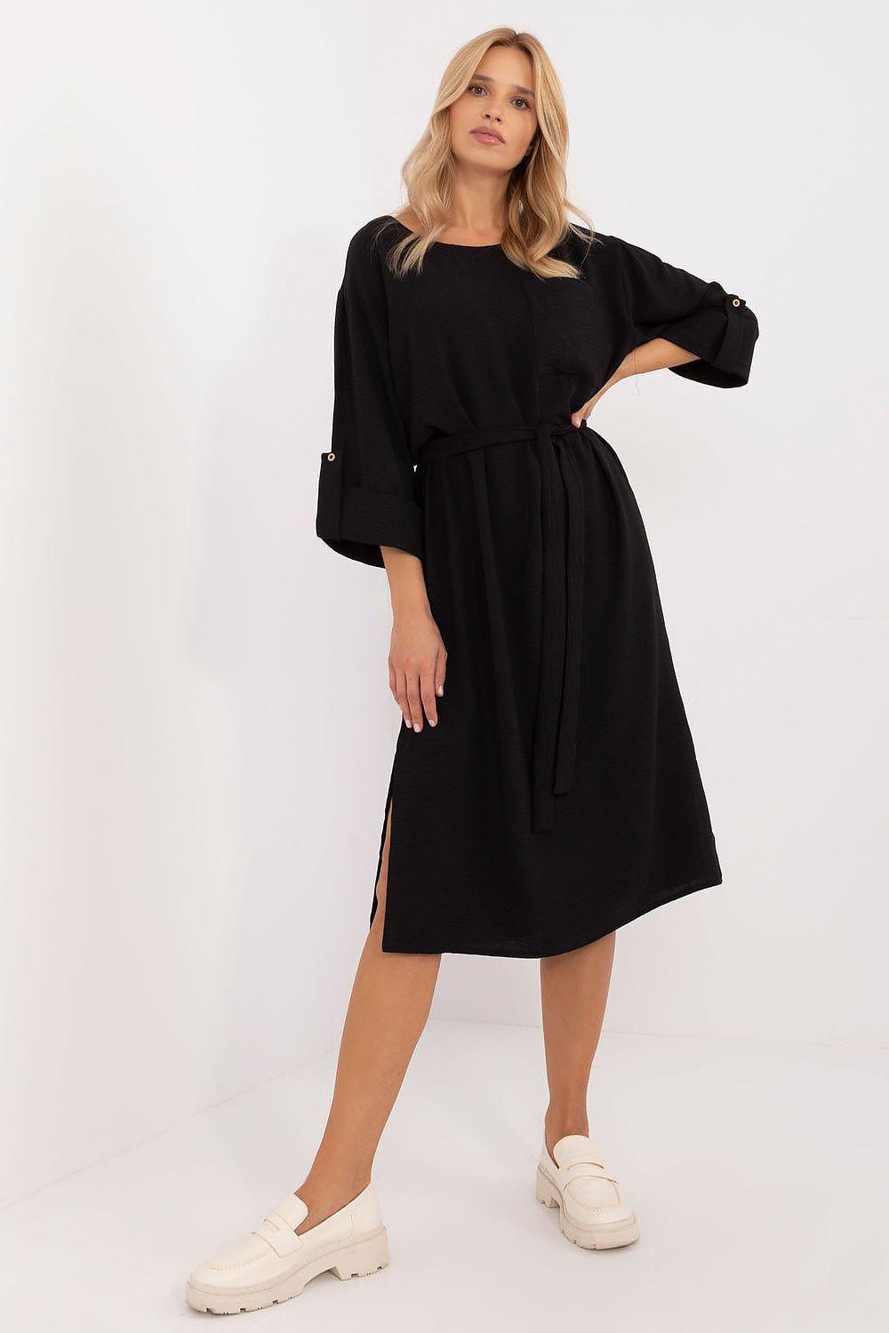 Black daydress with tie waist, elbow-length sleeves, square neckline, midi length slit