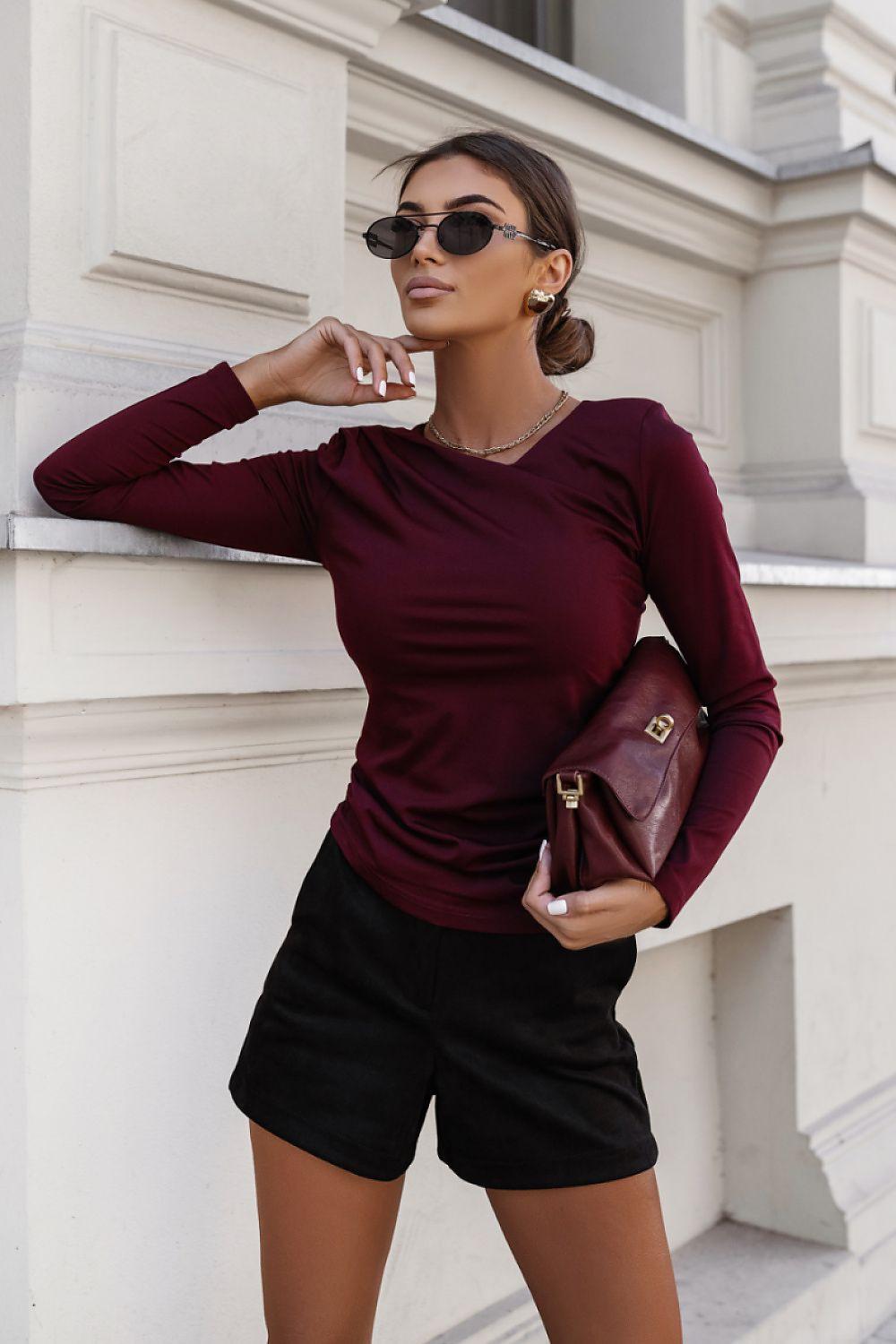 Burgundy long-sleeve blouse with gathered neckline and fitted waist.