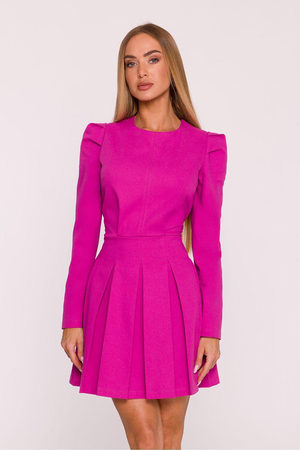 Pink daydress with long sleeves, gathered shoulder detail, and pleated skirt.