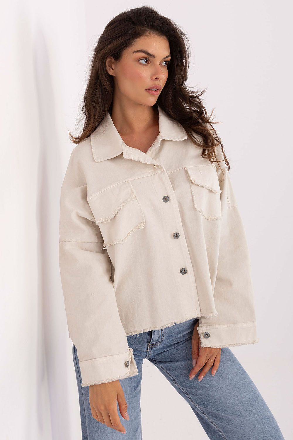 Light beige long sleeve shirt with button front and chest pockets