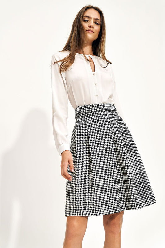 High-waist houndstooth skirt with pleated A-line silhouette, black and white
