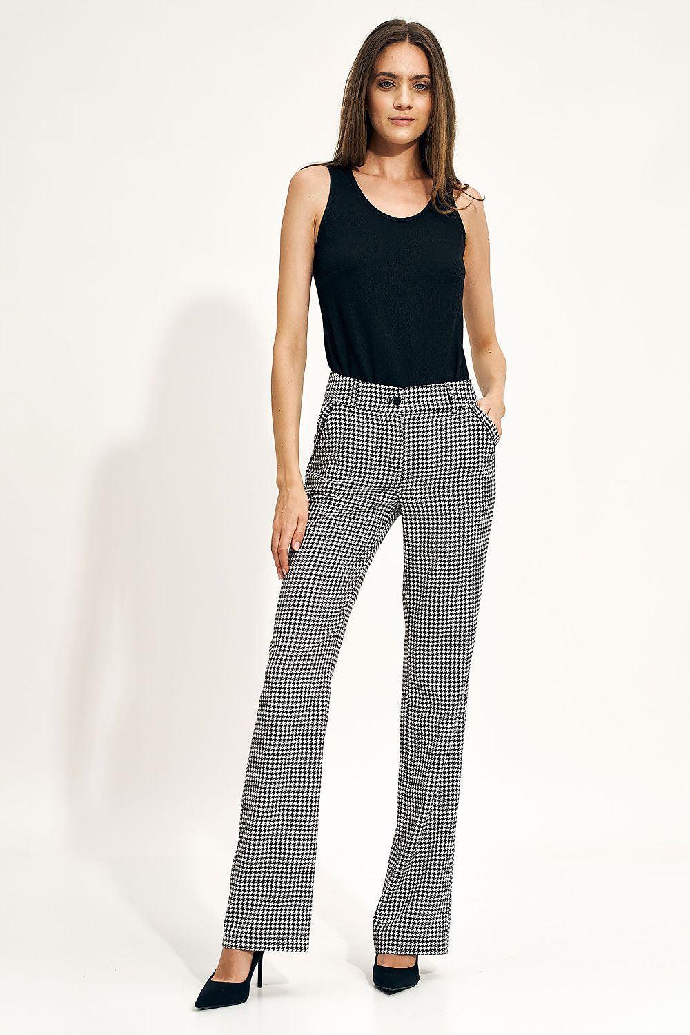 Houndstooth flared trousers, black-and-white check, high waist.