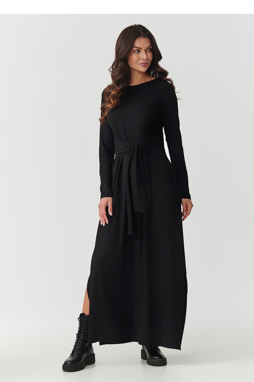 Black daydress with long sleeves, round neckline, tied waist, maxi length with side slit
