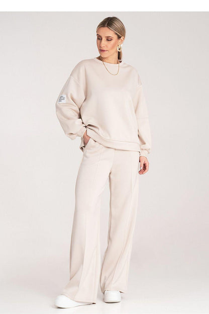 Beige two-piece loungewear set with crewneck sweatshirt and wide-leg pants