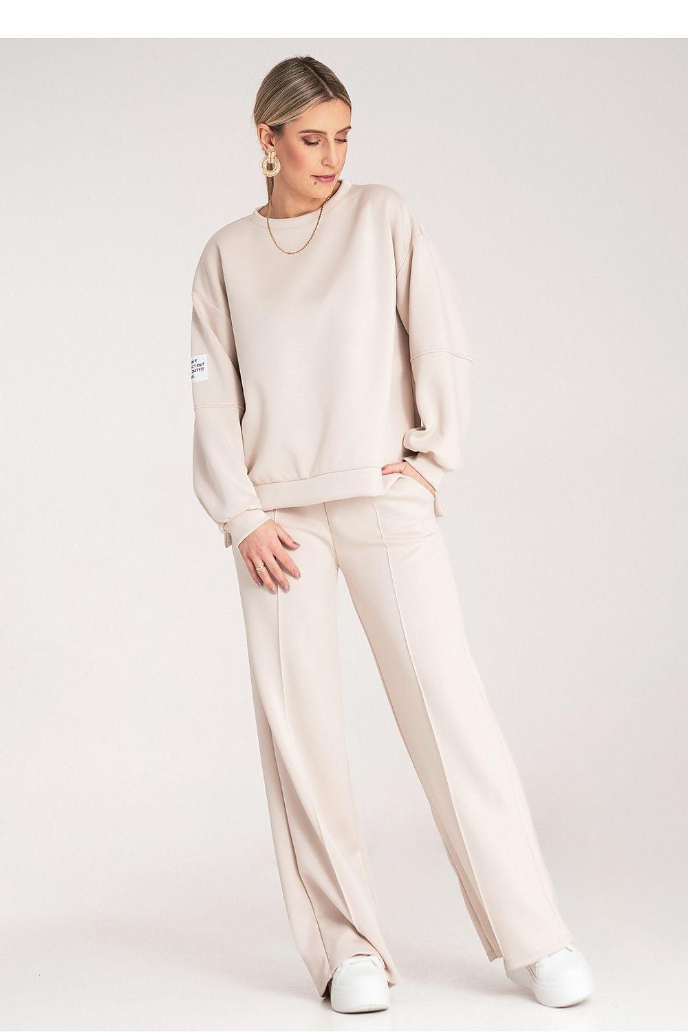Beige two-piece loungewear set, side view, long sleeves and relaxed wide-leg trousers