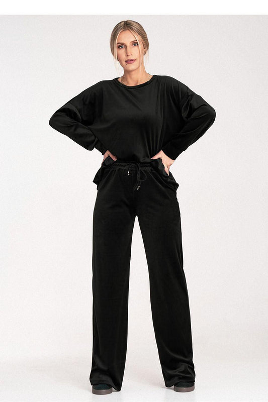 Black velour lounge set: crewneck long-sleeve top and wide-leg drawstring pants.
