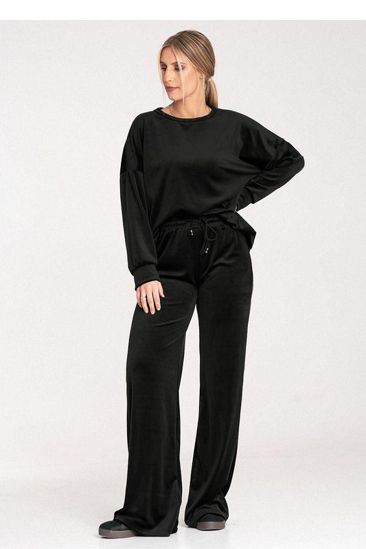 Black velour lounge set, crewneck long-sleeve top and wide-leg drawstring trousers.