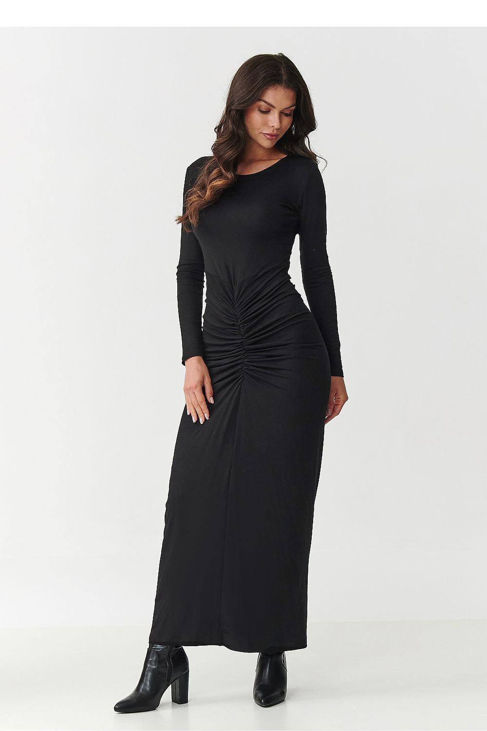 Black ruched maxi day dress with long sleeves and round neckline, gathered waist.