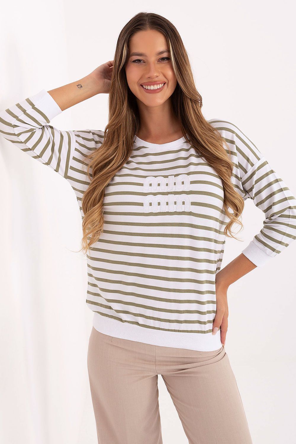 Green-and-white striped blouse with three-quarter sleeves and rounded neckline