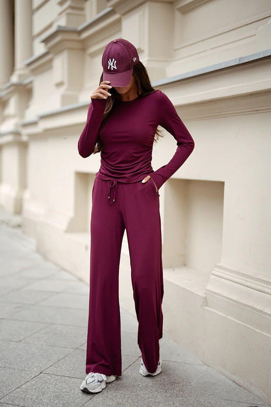 LaBalancia burgundy two-piece set with ruched long-sleeve top and wide-leg trousers
