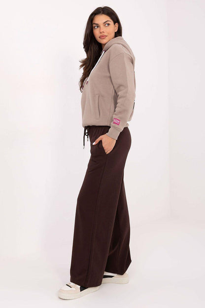 Brown tracksuit trousers with wide straight legs and drawstring waist