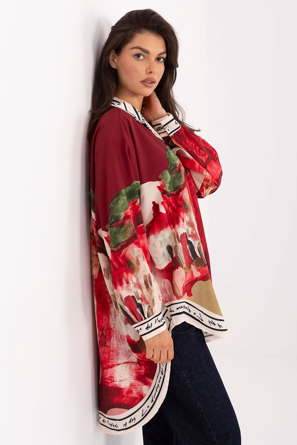 Long sleeve shirt with bold red, white, and green abstract print; button-front and collar