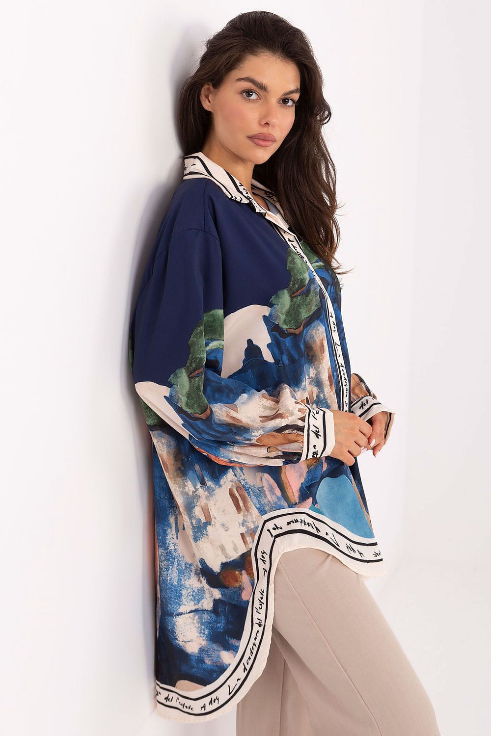 Long sleeve shirt with navy and blue abstract print; button-front and collar