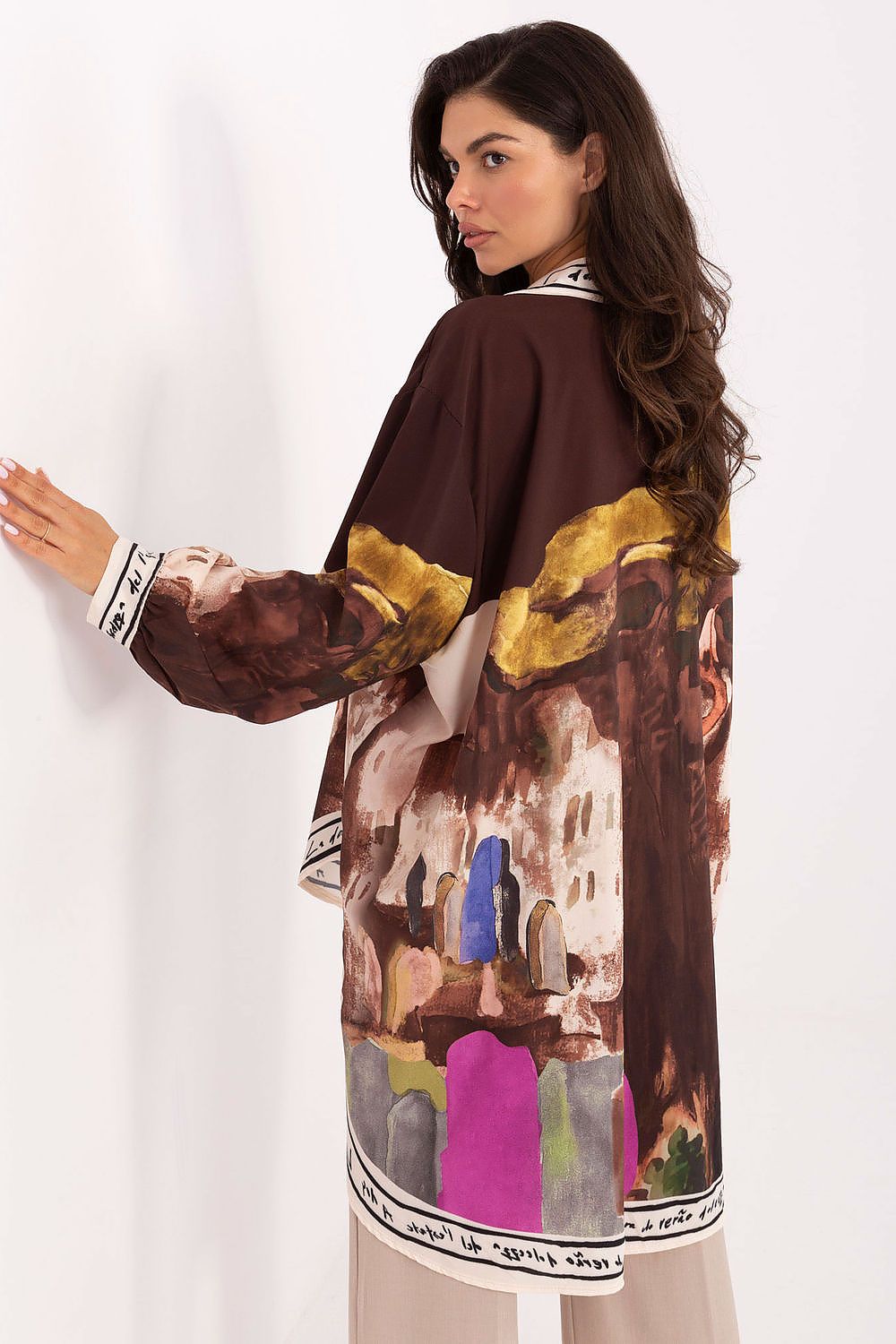 Women’s long sleeve shirt, back view, with abstract painterly print in brown and multicolor