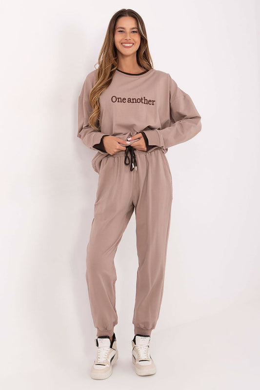 Beige women’s tracksuit set with embroidered sweatshirt and drawstring joggers