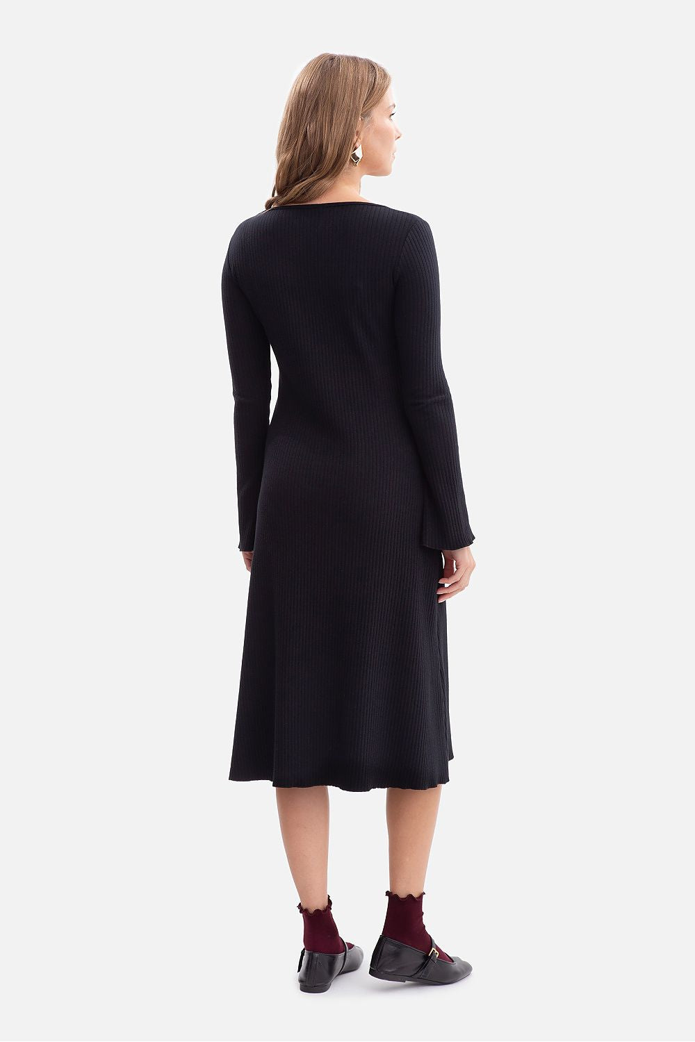 Ribbed daydress long sleeve scoop neck with midi wavy hem, shown from back in black