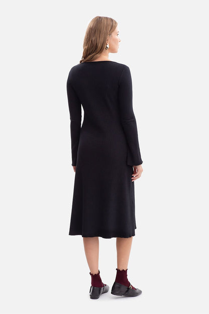 Ribbed daydress long sleeve scoop neck with midi wavy hem, shown from back in black