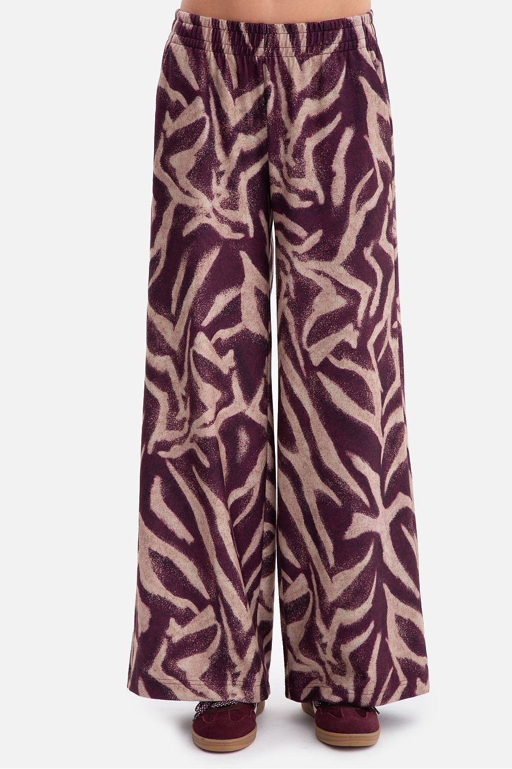 Women’s wide-leg trousers with abstract zebra pattern in purple and beige.