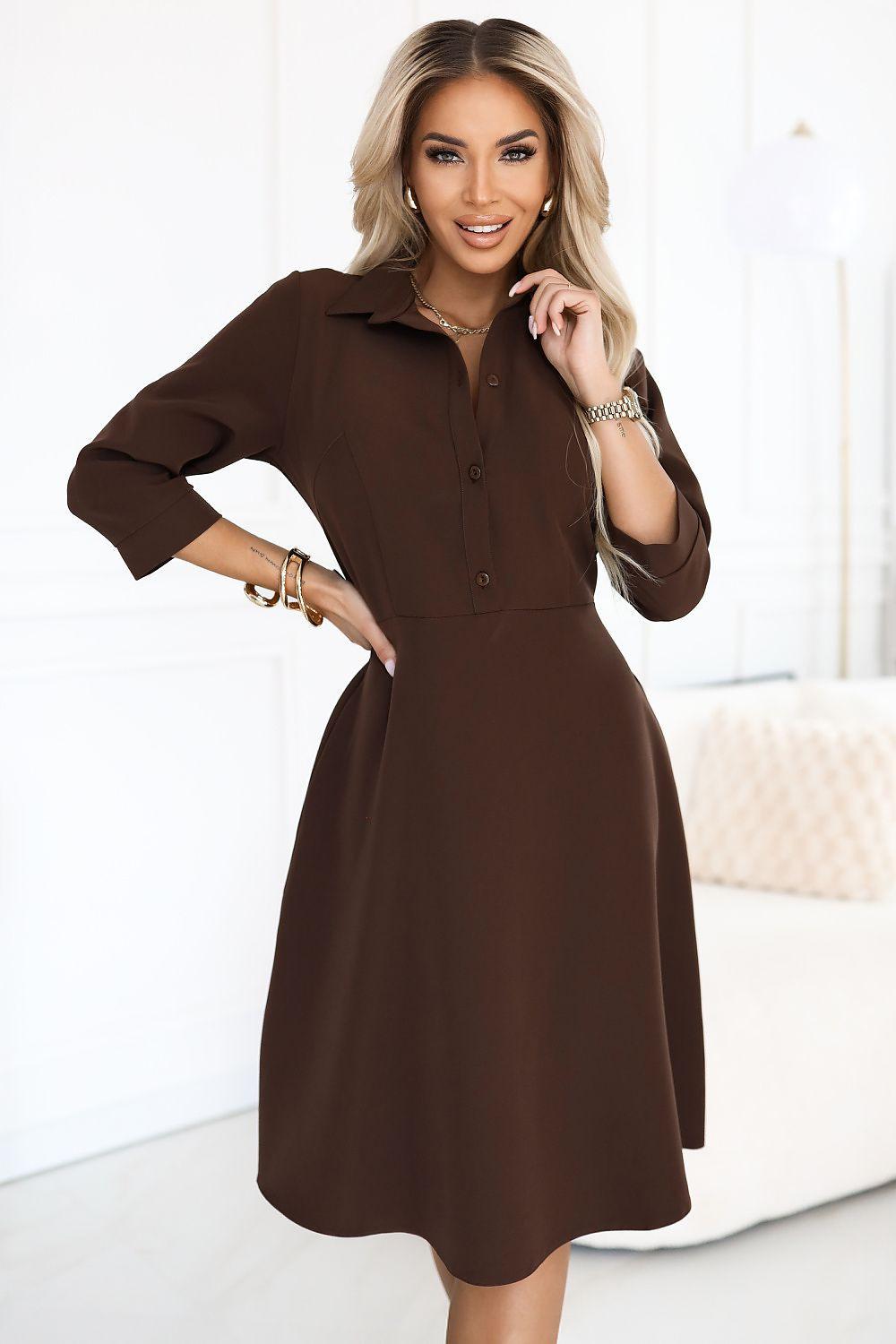 Dark brown daydress with button front, gathered waist, three-quarter sleeves, knee length