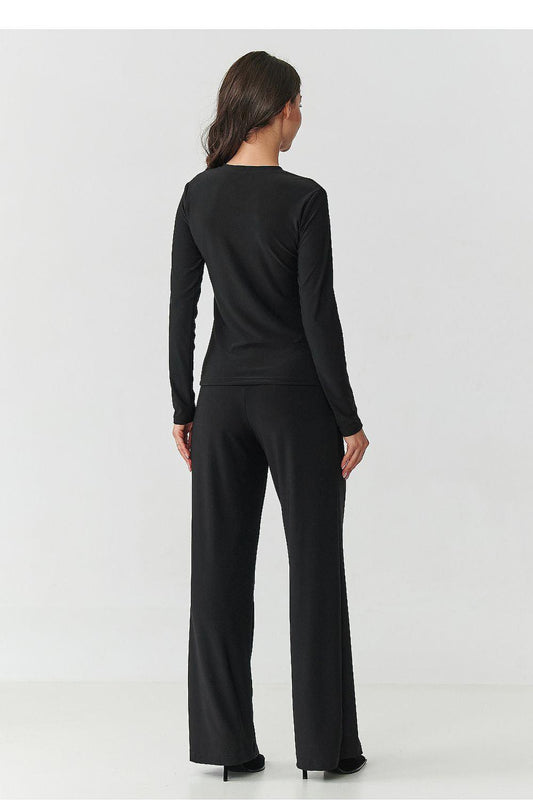 Makadamia jumpsuit set, black long-sleeve back view with wide legs