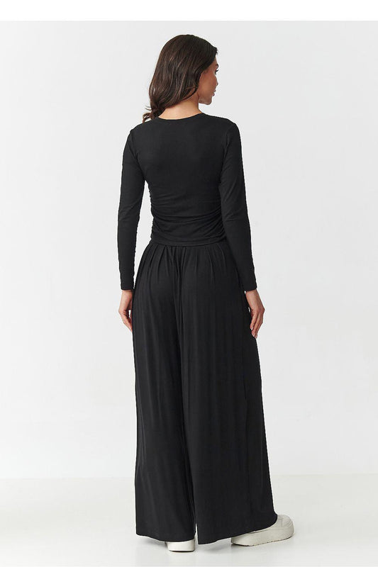 Back view of black long-sleeve top with elastic waist wide-leg maxi skirt set