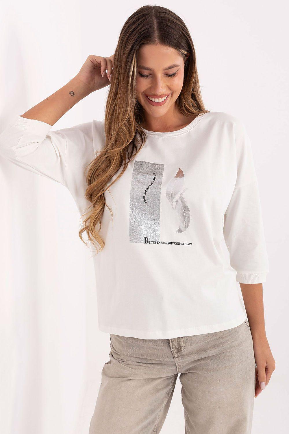 White cotton blouse with metallic-style graphic and 3/4 sleeves, crew neck.