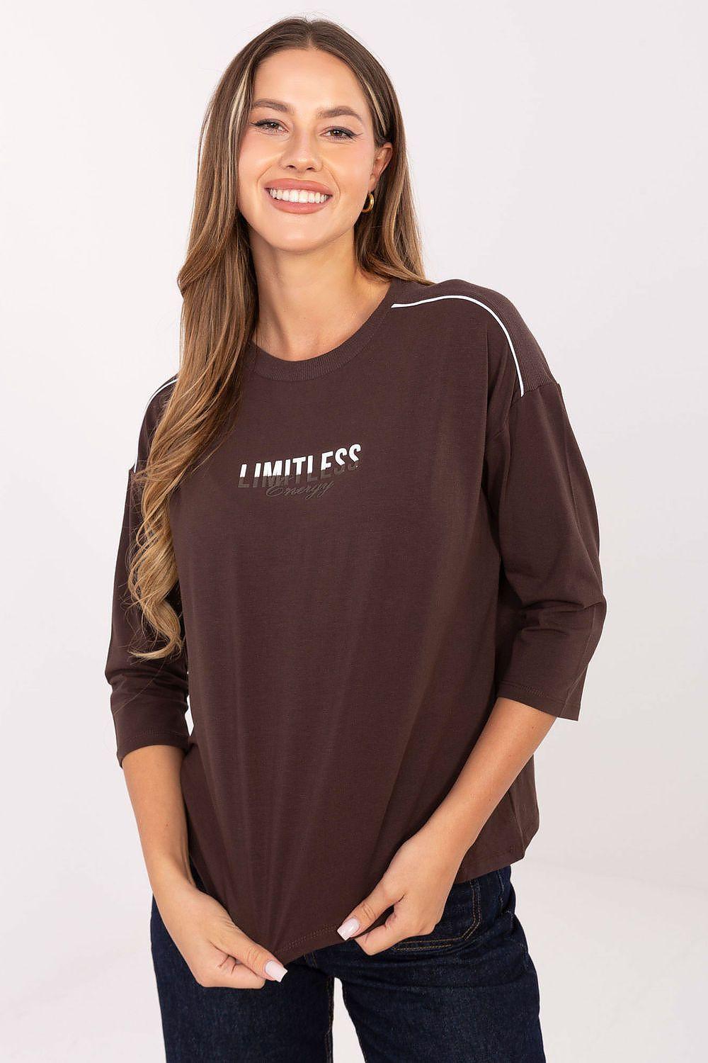 Brown cotton blouse with 3/4 sleeves and embroidered “Limitless” graphic on chest