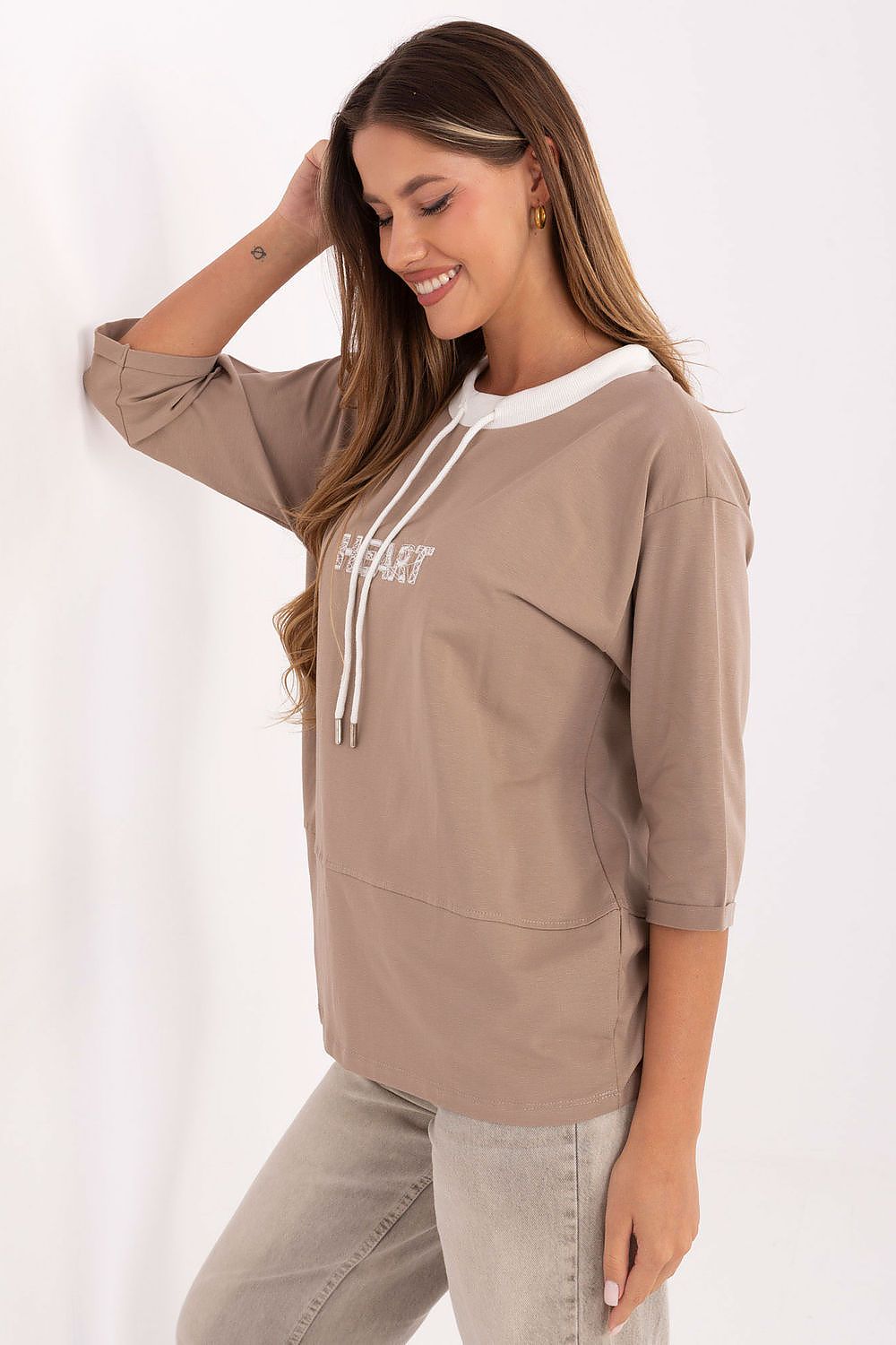 Beige blouse with drawstring neck and white HEART graphic, side view, 3/4 sleeves