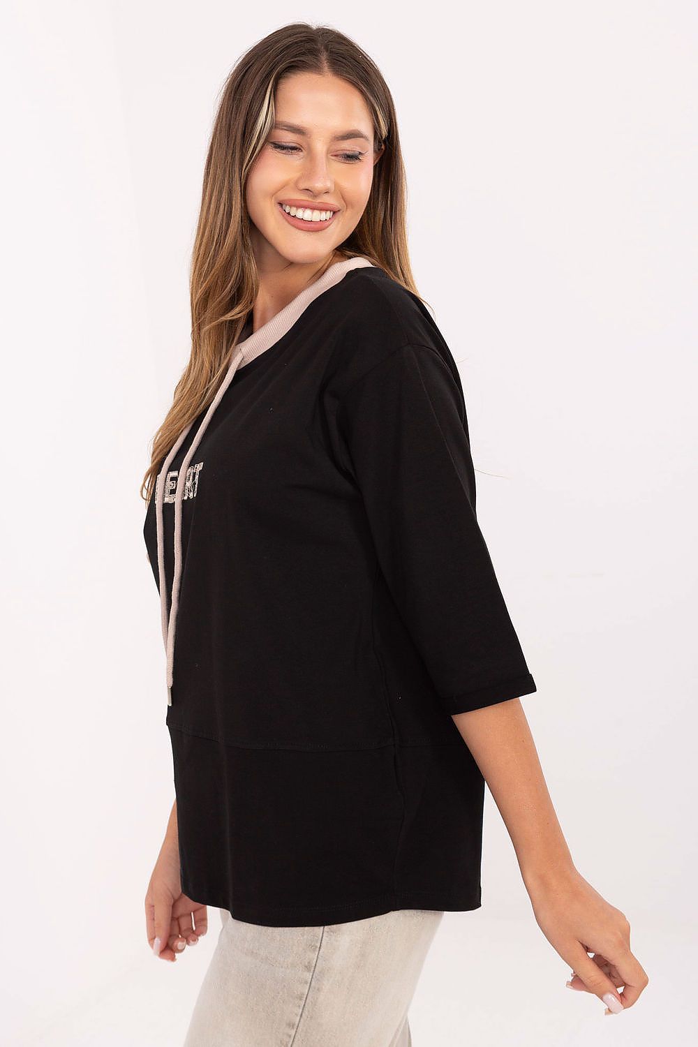 Black blouse with drawstring neck and white HEART graphic, 3/4 sleeves, side view