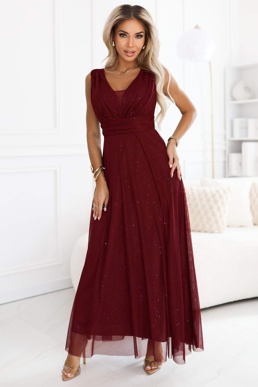 Red sleeveless maxi evening dress with V-neck, ruched waist, and sparkly sheer overlay
