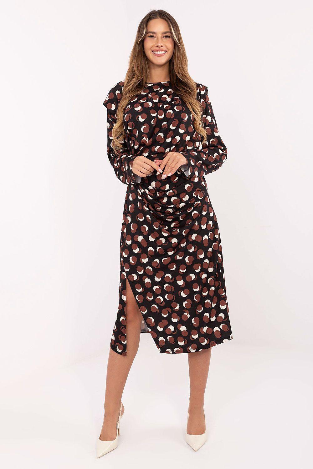 Black geometric midi daydress with draped waist, long sleeves, and front slit