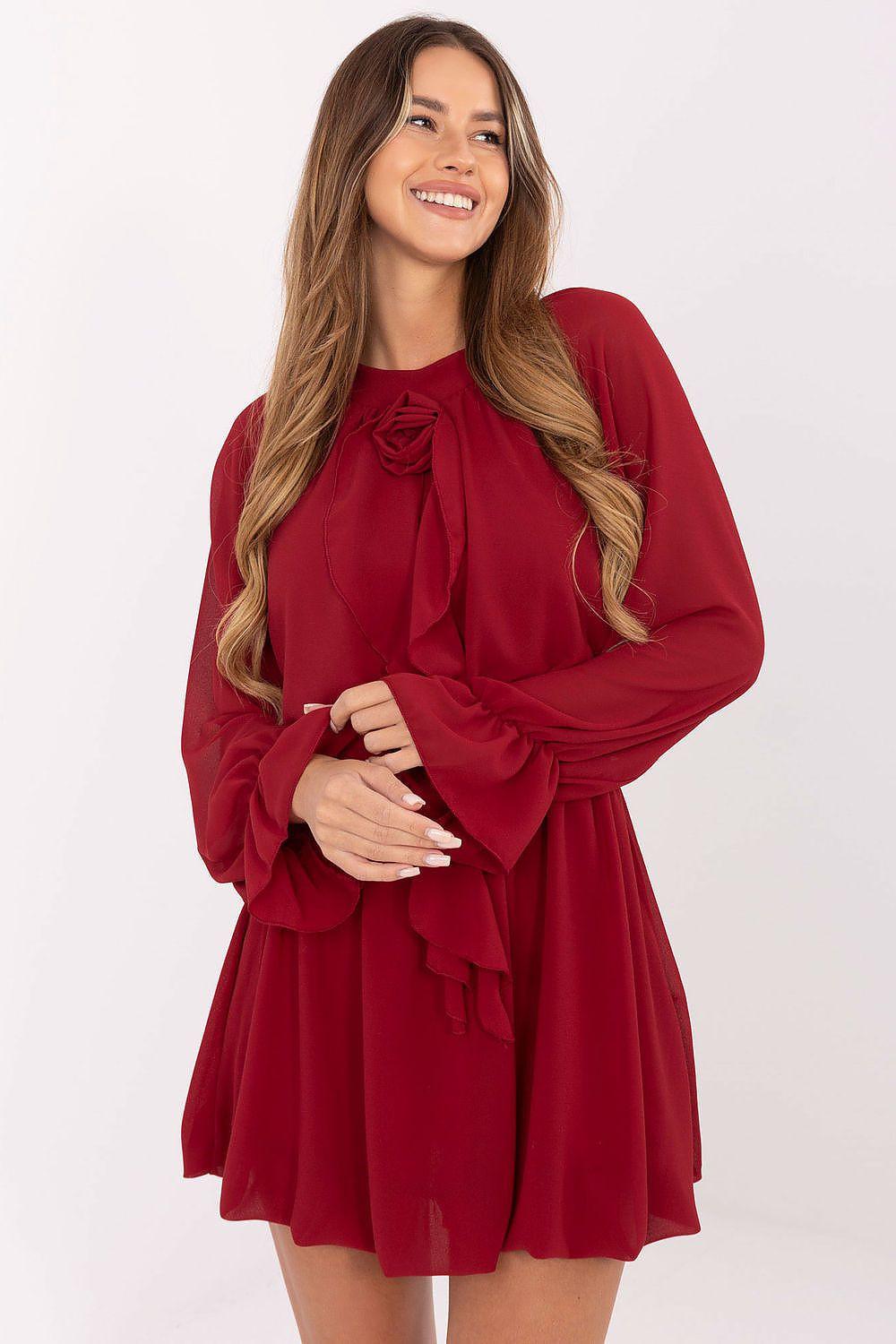 Cocktail dress in burgundy with long sleeves, bow tie neckline, and tiered skirt.