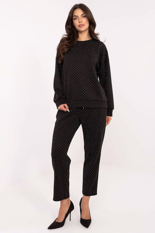 Black dotted knit two-piece pants set with long-sleeve top and ankle-length trousers