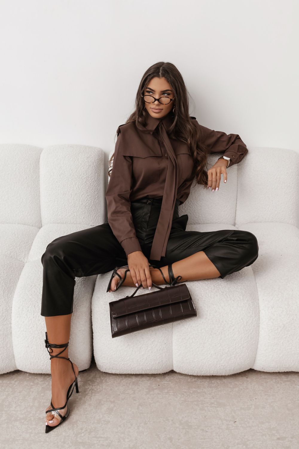 Brown long-sleeve button-up shirt with pointed collar and button-front closure