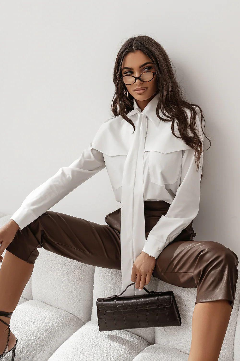 White long-sleeve button-up shirt with pointed collar and relaxed fit